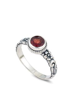 A floral design made of garnet adds a feminine style to this sterling silver ring. 5/16" L X 5/16" W Sterling silver, garnet Wipe with polishing cloth 1 year unlimited brand warranty Imported Orders cannot be shipped to Canada, Puerto Rico, APO, FPO or P.O. Boxes. Garnet Birthstone Rings, Round Solitaire Rings, Garnet Ring Silver, Garnet Birthstone, Garnet Rings, Birthstone Ring, Womens Jewelry Rings, Feminine Style, Luxury Jewelry