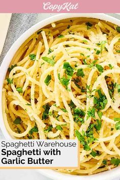 spaghetti with garlic and parsley in a white bowl