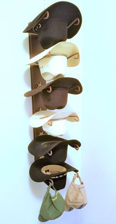 Product DescriptionYou will Love this Cowboy Hat Holder.  Easily holds up to Six Cowboy Hats. Designed to Keep Your Hats Shape.  It is decorative and functional and you will love that it looks great on any wall. The decorative stars make this hat rack great Western Wall Art as well. Some Assembly Required.  Proudly Made in The USA!  Item is Hand Finished and Powder Coated.  Wall Mounting Hardware is included.Please note product may vary slightly from photos. NEW Improved U shape bracket for easi Welded Crafts, Cowboy Hat Holder, Hat Holders, Wall Hat Racks, Cowboy Hat Rack, Cowboy Hat Design, Hat Racks, Wall Hats, Horseshoe Decor