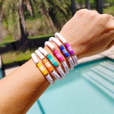 🛒Express your summer style with these bright and cheerful Ombre Preppy Bracelets! Featuring a mix of Heishi clay beads, these colorful bracelets are perfect to wear alone or stacking to add a little fun to any outfit. Great for gifts for her! Who wouldn't love these cheerful, summer-inspired bracelets? 📦FREE SHIPPING on orders $35 or more to US shoppers 💎Care = We recommend: -Remove when sleeping -Allow perfumes and lotions to dry before wearing -Roll the bracelet gently on and off your hand instead of overly-stretching the bracelet -Keep away from moisture (although polymer clay itself is water resistant, to extend the life of your jewelry you should avoid wearing in the shower or bath, pool, ocean, or lake, or around water-based chemicals) 🧵Material = 6mm Polymer Clay Heishi Beads, 6 Purple Heishi Bracelet Ideas, Multicolor Friendship Bracelets For Beach Season, Multicolor Round Bead Friendship Bracelets For Beach Season, Multicolor Round Beads Friendship Bracelets For Beach Season, Multicolor Friendship Bracelets With Round Beads For Beach Season, Multicolor Friendship Bracelets With Colorful Beads For Beach Season, Rainbow Letter Beads Friendship Bracelets For Beach, White Fun Bracelets For Vacation, Fun White Bracelets For Vacation