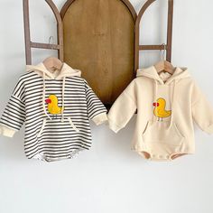 Quack up your little one's style with our Duckie Hoodie Romper! This adorable ensemble combines the cuteness of a romper with the coziness of a hoodie. Made from soft and comfy fabric, it features charming duckie prints that add a playful touch to their outfit. The hoodie design keeps your baby warm and snug, while the convenient snap closures make dressing and changing a breeze. ﻿ Material: Cotton. Color: Stripped, Beige. Hoodie Romper, Spring Rompers, Neutral Baby Clothes, Long Sleeve Outfits, Baby Unisex, Baby Hoodie, One Piece Outfit, Baby Outfit