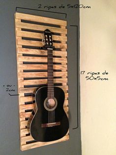 a guitar is mounted to the wall with wooden slats on it's sides