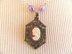 Vintage Cameo Pendant Necklace Purple Silver Tone Freshwater Pearl Adjustable Vintage Pearl Pendant Necklace Gift, Vintage Pearl Pendant Necklace As Gift, Vintage Pearl Necklace With Lobster Clasp, Vintage Purple Pendant Necklace, Vintage Pearl Necklace With Lobster Clasp For Gift, Vintage Pearl Necklace As A Gift, Vintage Round Purple Necklace, Vintage Purple Round Necklace, Cameo Pendant Necklace