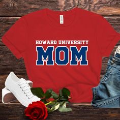 Howard University Bella Canvas Unisex T-Shirt (Sizes Small to 4X) Show your Bison pride with this stylish and comfortable Bella Canvas unisex t-shirt! Perfect for students, alumni, and fans of Howard University, this tee is a must-have addition to your wardrobe. Whether you're a proud mom, sister, auntie, or grandma, this shirt is designed to celebrate your connection to Howard University. Product Details: Brand: Bella Canvas Material: 100% Airlume combed and ring-spun cotton (heather colors contain polyester) Sizes Available: Small to 4X Fit: Unisex sizing for a relaxed and comfortable fit Features: Soft and lightweight fabric Durable and long-lasting print Available in red or Navy Perfect for everyday wear or special occasions Care Instructions: Machine wash cold, inside-out, with like c V Neck Shirts, Howard University, Proud Mom, Family Shirts, Neck Shirt, Canvas Material, Lightweight Fabric, Bella Canvas, Unisex T Shirt