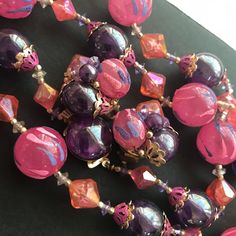 ON SALE Purple pink Lucite beaded Hong Kong signed matching jewelry set 1950s 1960s collectible necklace earrings in very good vintage condition. Earrings are approximately 1 inch round and the necklace is 26 inches long. A really nice matching set perfect for any outfit. Round Lucite Jewelry For Parties, Retro Purple Jewelry For Gifts, Retro Colorful Beads Jewelry For Jewelry Making, Retro Colorful Beads Jewelry For Making, Vintage Adjustable Purple Jewelry, Adjustable Vintage Purple Jewelry, Pink Large Beads Jewelry For Party, Pink Large Beaded Jewelry For Parties, Pink Round Beaded Necklaces For Party