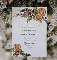 an orange slice on top of a wedding card