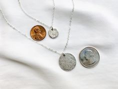 Choice of Small or Large Minimalist Silver Hammered Coin Medallion Necklace Silver Coin Necklaces are classic and timeless. These pieces are no exception. Select your choice of Large or Small (or both) Coin Necklace(s) at checkout- *Sold individually, but shown pictured together for displaying style options. Features a .999 Fine Silver over Pewter Disc Coin that has been hammered for that highly sought after rustic look of an ancient coin. Both sides are textured the same, so this is very easy t Adjustable Silver Coin Necklace Gift, Adjustable Sterling Silver Coin Necklace Gift, Adjustable Metal Coin Necklace For Gifts, Non-toxic Dangle Necklaces As Gifts, Adjustable Round Disc Nickel-free Necklaces, Adjustable Coin Pendant Charm Necklace As Gift, Dangle Coin Necklace For Gift, Metal Round Coin Necklace As A Gift, Round Metal Coin Necklace As A Gift