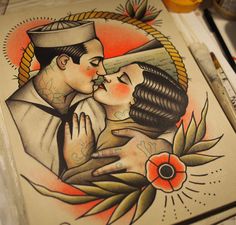 a couple kissing each other in front of a tattoo art print on paper with markers