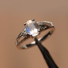 It is natural moonstone ring, the main stone is about 6mm*8mm, oval cut, The basic metal is sterling silver and plated with rhodium. To change the metal to a solid gold (white/rose) or platinum is also available, please ask for a quotation if you want. You can also go to my shop Home for more elegant rings: https://www.etsy.com/shop/godjewelry?ref=hdr_shop_menu More alexandrite rings: https://www.etsy.com/shop/godjewelry?ref=seller-platform-mcnav&search_query=moonstone Customization is alway Moonstone Engagement Ring Silver, Alexandrite Rings, Elegant Rings, Pretty Engagement Rings, Edgy Jewelry, Cute Engagement Rings, Future Engagement Rings, Moonstone Ring Sterling Silver, Alexandrite Ring