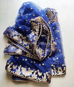 Blue Net Dupatta for women. Dupatta is custom made for bridal weddings It is made using dyeable net fabric with golden Sequines work all over. A Banarsi Brocade border along with Golden beaded lace is attached to dupatta. Dupatta is having a length of 100 inches and width of around 40 inches. I don't keep it readymade I only make it exclusively for my customers. Can be fully customised. Semi-stitched Gold Sharara With Embroidered Border, Gold Semi-stitched Sharara With Embroidered Border, Blue Organza Anarkali Set For Festive Occasions, Anarkali Style Blue Lehenga In Net Material, Festive Blue Organza Anarkali Set, Traditional Organza Anarkali Set For Celebration, Gold Chanderi Sharara With Embroidered Border, Blue Organza Sharara For Navratri, Blue Net Lehenga For Festive Occasions