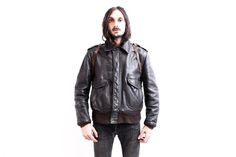 ⚜  Description  ⚜ Lovely A-2 Flight Leather Jacket  From SCHOTTMADE IN USA Quilted Interior. Thick Robust Leather Shell Talon Heavy Duty Zipper and snap closing System Estimated Size is Medium. Size on Label is 44 100% Leather Good Vintage Condition! ⚜  Measurements  ⚜  Armpit to Armpit: 64 cm or 25''  Sleeve (From Shoulder Seam to end of cuff): 64 cm or 25' Shoulder to Shoulder: 50cm or 20 '' Overall Length From Shoulder to bottom hem: 68 cm or 27 '' B1766 Vintage Biker Jacket With Zipper Closure For Outdoor, Vintage Outdoor Biker Jacket With Zipper Closure, Vintage Biker Jacket With Zipper For Outdoor, Vintage Biker Jacket For Streetwear With Zip Detail, Vintage Outerwear With Ykk Zipper For Fall, Vintage Biker Jacket With Zipper For Streetwear, Retro Leather Jacket With Pockets For Streetwear, Aviation Jacket, Usa Quilt