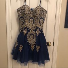 Navy Strapless Dress With Gold Embroidery. Lace Up/Corset Back. New With Tags. Such A Beautiful Dress Pictures Don’t Do It Justice. New With Tags. Built In Padding In Chest. Formal Dance Dresses, Lace Up Corset Back, Blondie Nites Dress, Hoco Inspo, Strapless Sequin Dress, Godet Skirt, Satin Ball Gown, Dress Pictures, Lace Up Corset