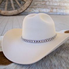 Silver and Rhinestone Bling Hat Band for cowgirls. Dress up your cowboy hat with this gorgeous hat jewelry!This rhinestone strand hatband comes with 3 layers of clear rhinestones set on silver metal. It is adjustable with a metal clasp in the back. Fits up to size 7 1/2 hat. * Hat not included. Adjustable Western Jewelry For Party, Adjustable Western Style Party Jewelry, Adjustable Western Style Jewelry For Parties, Western Style Silver Party Jewelry, Western Silver Jewelry For Parties, Western Style Silver Jewelry For Party, Western Bling Hat For Rodeo, Western Hats With Bling For Rodeo, Western Style Hat With Bling And Curved Brim