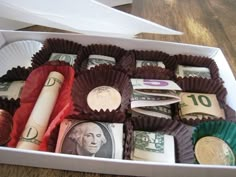 a box filled with lots of different types of money