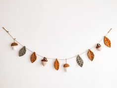 a string with leaves and acorns hanging from it