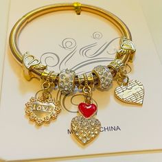 Stretchy Heart Charm Bracelet Beautiful Gold Anniversary Charm Bangle Bracelet For Valentine's Day, Anniversary Bangle Charm Bracelet For Valentine's Day, Valentine's Day Anniversary Charm Bangle Bracelet, Gold Heart Beads Bracelet For Party, Metal Charm Bracelet With Heart Charm For Party, Gold Heart Bracelet For Valentine's Day Party, Metal Heart Beads Bracelets For Party, Metal Bracelets With Heart Beads For Party, Metal Charm Bracelet With Heart Charm For Mother's Day