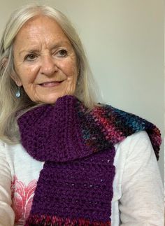 "This is a beautiful winter scarf made in the cool colors of violet, purples, rose and blue.  The major color is dark violet.  It's handmade by \" An Artist with Yarn\" and will not be duplicated.  All of my creations are one of a kind.  The scarf measures 50\" long and 5'5 inches wide and is very soft and comfortable.  It will add to any wardrobe and will make a fashion statement for you.  Wear it with jeans or dress up slacks.  It's a great wear for the inside of your coat or outside your coat Winter Scarf Crochet, Magenta Scarf, Bulky Scarf, Scarf Women Winter, Purple Crochet, Dark Violet, Handmade Scarf, Cool Colors, Handmade Scarves