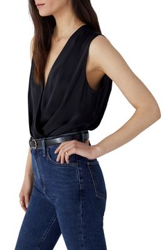 Date night is calling in this blousy sleeveless top styled in a sultry wrapped fit. Surplice V-neck Sleeveless Lined gusset 100% polyester Dry clean or hand wash, dry flat Imported Chic V-neck Bodysuit For Date Night, Chic V-neck Bodysuit For Evening, Chic V-neck Evening Bodysuit, Elegant Sleeveless Bodysuit For Evening, Sleek Sleeveless Bodysuit For Night Out, Elegant Sleeveless Evening Bodysuit, Sleeveless Sleek Top For Date Night, Sleek Sleeveless Top For Date Night, Chic Sleeveless Bodysuit For Date Night