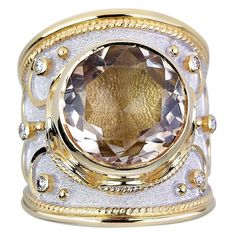 S.Georgios designer ring in solid 18 Karat Yellow Gold all handmade with Byzantine workmanship - granulation work microscopically decorated over the unique velvet effect background with white rhodium oxidization. The center of the ring decorates with a round clear Quartz with a total weight of 9.03 Carat and 6 Brilliant cut Diamonds total weight of 0.30 Carat. Front Width: 24.50 mm Back Width: 9.70m m Weight: 22,70 gr Size: 8.5 (can be custom sized to fit) For a full selection of my jewelry plea Sapphire Cocktail Ring, Microscopes, Diamond Cocktail Rings, Domed Ring, White Gold Ring, Brilliant Cut Diamond, Bling Bling, Cocktail Rings, White Gold Rings