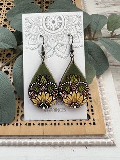 Boho style Wood mandala sunflower earring Green Bohemian Hand Painted Jewelry, Green Hand-painted Bohemian Earrings, Green Hand Painted Bohemian Earrings, Bohemian Yellow Sunflower Earrings, Bohemian Hand Painted Dangle Flower Earrings, Handmade Green Bohemian Flower Earrings, Handmade Bohemian Green Flower Earrings, Bohemian Sunflower Earrings As Gift, Bohemian Sunflower Design Earrings For Gift