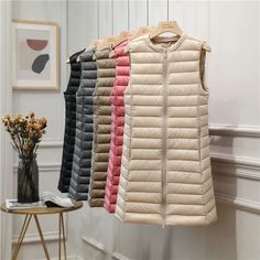 SPECIFICATIONSBrand Name: NoEnName_NullPattern Type: SolidStyle: CasualOrigin: Mainland ChinaCN: ZhejiangSeason: WinterAge: MIDDLE AGEClothing Length: longFilling: White duck downMaterial: nylonDown Weight: 100g-150gHooded: NoSleeve Length(cm): sleevelessModel Number: down vestCraft of Weaving: TATRelease Date: Autumn 2023Thickness: STANDARDDown Content: 90%Gender: WOMENWeight: 0.30kgsPlace Of Origin: China (mainland)Detachable Part: noneType: SlimDecoration: ZippersDecoration: PocketsClosure Ty Long Waistcoat, Winter Bottoms, Navy Blue Coat, Light Down, Gilet Long, Long Vests, Casual Vest, Outerwear Vest, Blue Coats