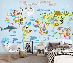 a child's bedroom with a map of the world painted on the wall