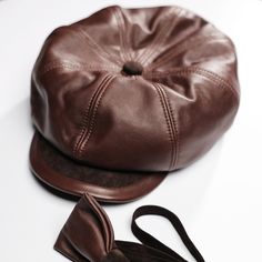 If you are searching for ways to stand out in the crowd with your look,then a Newsboy Cap is what you are looking for. Leather hat can attract a great visual interest  to your appearans.It adds instand personality to a look.The brown cap is the ultimate partner for a fashionable styling for the season. Genuine leather,cotton lining. M-56cm L-58cm Brown For men Leather Flat Cap Hat For Fall, Leather Flat Cap For Fall, Classic Brown Baseball Cap, Brown Fall Baseball Cap For Outdoor, Classic Brown Baseball Cap For Outdoor, Brown Retro Hat For Outdoor, Brown Adjustable Baseball Cap For Fall, Classic Brown Baseball Cap For Winter, Adjustable Brown Baseball Cap For Fall