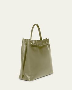 Bottega Veneta "Andiamo" tote bag in silky calf leather     Top handle     Sliding shoulder strap with knot hardware accent     Can be worn as a top handle or shoulder bag     Open top with magnetic closure     Interior, one zip pocket and two slip pockets     Lining: Suede    Feet protect bottom of bag     Approx. 9.8"H x 12.5"W x 4.3"D    Made in Italy Elegant Shoulder Bag With Rolled Handles For Daily Use, Top Handle Bag With Rolled Handles For Daily Use, Chic Satchel Bag With Rolled Handles, Daily Use Bags With Rolled Top Handles, Chic Leather Hobo Bag With Rolled Handles, Chic Rectangular Shoulder Bag With Rolled Handles, Elegant Bucket Bag With Rolled Handles For Daily Use, Elegant Bucket Bag With Rolled Handles For Travel, Shoulder Bag With Rolled Handles For Everyday