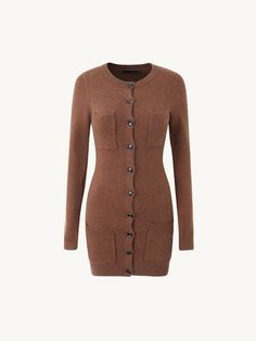 Embrace a blend of comfort and style with the Kirby Cozy Knit Button-Up Dress. This versatile piece features a fitted silhouette, enhanced with a button-up front for a classic touch. Perfect for cooler weather, its soft knit fabric ensures all-day comfort, while the two front pockets add a practical yet chic element. Available in elegant black and warm brown tones, this dress is ideal for casual outings, workwear, or relaxed weekends at home. Details: Crafted from a soft, breathable knit fabric Cozy Fitted Cardigan With Button Closure, Casual Sweater Dress With Buttons For Fall, Fall Sweater Dress With Buttons And Long Sleeves, Long Sleeve Sweater Dress With Buttons For Fall, Long Sleeve Button Sweater Dress For Fall, Casual Long Sleeve Sweater Dress With Buttons, Long Sleeve Sweater Dress With Button Closure For Winter, Winter Long Sleeve Sweater Dress With Button Closure, Winter Sweater Dress With Button Closure