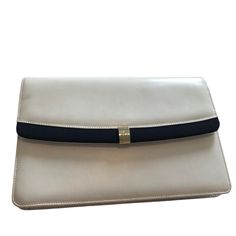 Vintage Salvatore Ferragamo Leather Shoulder Bag. Can Also Be Used As A Clutch Or Crossbody. White With Blue Trim On The Front Flap. Magnetic Snap. Inside Zippered Pocket. Comes With Authenticity Card And Dust Bag. There Are A Few Scuffs And Scratches But Not Very Visible. Inside Looks Brand New. Height Is Approx. 7.5 Inches. Width Is Approx. 11 Inches. Adjustable Shoulder Strap Is Approx. 32-39 Inches. Very Good Used Condition. Ferragamo Bag, Salvatore Ferragamo Bags, Croc Leather, Brown Leather Shoulder Bag, Brown Shoulder Bag, Blue Trim, Perforated Leather, Mini Shoulder Bag, Leather Silver