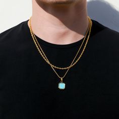 The gold turquoise stone pendant on a gold round box chain is a beautiful and eye-catching piece of jewelry. The pendant features a smooth and polished imitation turquoise stone, known for its captivating blue-green color and unique variations. The stone is carefully set in a luxurious gold bezel, accentuating its natural beauty and adding a touch of elegance. The pendant hangs gracefully from a gold round box chain, characterized by interconnected square links that create a modern and sophisticated look. The chain complements the pendant perfectly, offering a sleek and polished appearance. This pendant is a true representation of charm and style, combining the radiant allure of gold with the enchanting allure of turquoise. It serves as a stunning accessory that effortlessly elevates any e Gold Turquoise Pendant Necklace With Gemstone, Gold Turquoise Necklace With Round Pendant, Gold Turquoise Necklace With Adjustable Chain For Gift, Gold Turquoise Necklace With Adjustable Chain As A Gift, Gold Turquoise Gemstone Necklace As Gift, Gold Minimalist Turquoise Necklace Gift, Blue Jewelry With Gold Chain As Gift, Blue Gold Chain Jewelry Gift, Blue Jewelry With Gold Chain For Gift