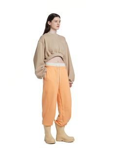 This sweatshirt from TRUNK PROJECT features trendy cropped length and logo embroidery on the chest.    - Pullover closure- Dropped shoulder- Ribbed knit cuffs, neckline, and hem- Paneled construction- Cropped length Sportswear Cropped Crop Top For Loungewear, Sportswear Crop Top For Loungewear, Oversized Sporty Cropped Sweater, Sporty Relaxed Fit Crop Top For Fall, Sporty Winter Loungewear Crop Top, Casual Cropped Sweatshirt With Ribbed Waistband, Cropped Bottoms For Fall Streetwear, Cropped Relaxed Fit Sweats For Athleisure, Sporty Cropped Bottoms For Loungewear