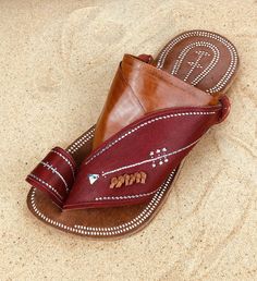 Use code COMBINEDSHIPPING and get $50 off your second pair. Check out all men's leather sandals: https://www.etsy.com/shop/sandcruisers/?section_id=25459641 You will love these traditional Arabian sandals. The straps and soles are made of leather. The leather lining will feel so soft and comfortable against your foot. They are designed to fit your foot loosely with lots of room in the toe-ring and straps. The leather sole will mold and shape to your foot over time, even creating an arch against Traditional Leather Flip Flops For Summer, Leather Flip Flops With Single Toe Strap For Festivals, Leather Single Toe Strap Flip Flops For Festivals, Leather Open Toe Flip Flops For Festivals, Traditional Leather Footbed Sandals For Beach, Leather Sandals With Rubber Sole For Festival, Traditional Beach Sandals With Stitched Sole, Summer Closed Toe Slippers With Stitched Sole, Traditional Leather Footbed Sandals For Summer