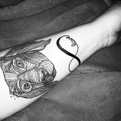 a woman's arm with a tattoo on it and the word love written in black ink