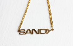 This is an awesome vintage name necklace from about the 70s! It is 14K Gold Plated and has never been worn.The name is about 1.5" wide.Model shown wearing “Marie” name necklace.NOTE: This CAN NOT be custom made. They are vintage, thus you will receive the exact same name in the photo above. We have lots of vintage name jewelry in the shop! You can see them all here at this link:https://www.etsy.com/shop/diamentdesigns/search?search_query=name&order=date_desc&view_type=gallery&ref=sho Vintage Nameplate Necklaces, Vintage Custom Name Jewelry Nameplate, Vintage Personalized Name Necklace For Anniversary, Vintage Personalized Nameplate Necklace, Personalized Vintage Name Necklace For Anniversary, Personalized Vintage Nameplate Necklace, Vintage Custom Name Nameplate Jewelry, Vintage Custom Nameplate Jewelry, Vintage Gold Name Necklace