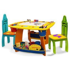 the children's table and chairs are colorfully painted with different shapes and colors