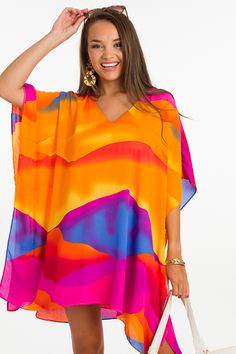 This caftan will have everyone looking your way! It's effortlessly stylish and oh so comfortable + with its lightweight and airy fabric, it's just right for summer! The wide sleeves are stitched down both sides, and caftan is also lined. Wear it as a tunic, dress, or a swimsuit cover up... you can't go wrong here! Oversized V-neck Spring Cover-up, Summer Beach Cover-up Flowy Blouse, Flowy V-neck Tunic For Beach Cover-up, Oversized V-neck Tunic For Beach Cover-up, Flowy V-neck Breezy Cover-up, Flowy V-neck Kimono For Day Out, Vibrant Print V-neck Tunic, Flowy Multicolor Tunic Cover-up, Chic Oversized Kaftan For Beach Cover-up