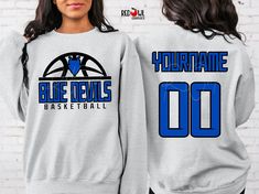 Personalized Blue Devil School Spirit T-Shirt Crewneck, Hoodie Hooded Sweatshirt Football, Baseball, Basketball, Softball, Track, Volleyball, Cross Country, Cheer, Wrestling Not all colors are available in all sizes and styles.  Please check the color and size charts in photos. We do our best to accurately represent shirt colors by using actual photos but do understand that all monitors will display differently. Please contact us prior to purchase with any questions on sizing or colors. Your purchase includes a custom imprint created specifically for your team! A product proof will be emailed to you within 1 business day.  Please keep an eye on your Etsy messages and reply with any changes within 24 hours. Your order will be sent to production after that time if no response is received. Ex Blue Team Spirit Hoodie With Team Name, Blue Team Spirit Sweatshirt With Team Name, Blue Pre-shrunk School Spirit Sweatshirt, College Team Name Blue Sweatshirt, Blue Sweatshirt With Team Name For Fan Gear, Relaxed Fit Blue Pre-shrunk Sweatshirt, Blue School Spirit Sweatshirt For Fans, Blue Cotton Team Spirit Sweatshirt, Blue Relaxed Fit Pre-shrunk Sweatshirt