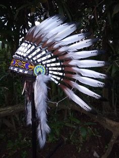 Kids Indian Headdress replica, Indian costume for kids, Kids Native American Headdress replica This lovely kids headdress is entirely handmade and truly adorable. Perfect photography prop for your child birthday.  Ties in the back for a perfect fit. This will be precious for your kids birthday photos, a costume, or even room decor. Head circumference: 55 centimeters = 21.65 inches ✈️ Worldwide shipping 🐤 I only use authentic feathers ⛺️ I  guarantee highest quality, 100% hand-crafted ♥ Indian Feather Headband Kids, White Themed Costume Hats And Headpieces, Themed White Costume Hats And Headpieces, White Fantasy Costume Hat, Newborn Costume, Native American Headdress, Toddler Wearing, Indian Headdress, Costume For Kids