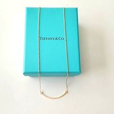 Tiffany & Co. Diamond T Small Pendant New And Authentic Color: 18k Gold Size: Small On A 16" Chain Carat Total Weight .10 Comes With Box Necklace Tiffany & Co., Tiffany Smile Necklace, Smile Necklace, Jewelry Tiffany, Tiffany T, Tiffany Co Jewelry, Small Pendant, Tiffany & Co., Womens Jewelry Necklace