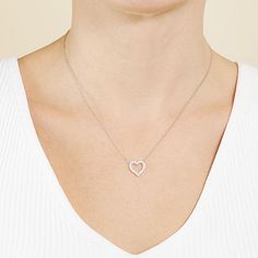 Simple and sleek best describes this Silver Treasures sterling silver Cubic Zirconia heart pendant necklace. This necklace is crafted in quality sterling silver, features beautiful sparkling Cubic Zirconia stones, comes in 16 inches with a 2 inch extender and has a spring ring clasp for a safe and comfortable wear. Wear this pendant necklace alone or stack with your other favorite necklaces. Wipe necklace clean with a soft cloth.Features: Nickel FreeJewelry Closure: Spring Ring ClaspLink Constru Dainty Heart Pendant Diamond Necklace In Sterling Silver, Dainty Sterling Silver Diamond Necklace With Heart Pendant, Dainty Sterling Silver Heart Pendant Diamond Necklace, Cubic Zirconia Open Heart Necklace In Fine Jewelry Style, Sterling Silver Heart Pendant Diamond Necklace, Sterling Silver Diamond Necklace With Heart Charm, Sterling Silver Diamond Heart Necklace, Open Heart White Gold Necklace With Cubic Zirconia, Dainty Silver Diamond Heart Necklace