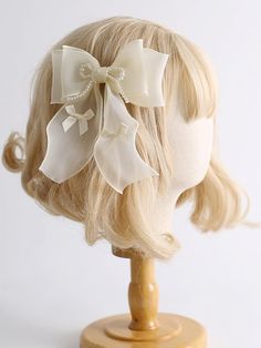 Add a touch of elegance to your hairstyle with our beige bead details organza bowknot hairclip. This exquisite hair accessory features delicate bead details and a charming organza bowknot, perfect for adding a feminine and sophisticated touch to any outfit.   Please note that this product includes only one hairclip. Elegant Beige Hair Accessories For Party, Elegant Cream Bow With Ribbon Detail, Elegant Cream Bow With Ribbon, Elegant Cream Bow For Parties, Elegant Cream Bow For Party, Elegant Party Hair Accessory With Detachable Bow, Elegant Cream Satin Bow, Party Hair Accessories Headband With Bow, White Satin Bow Hair Accessories For Party