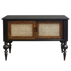 an old fashioned wooden cabinet with wicker doors and legs on one side, against a white background