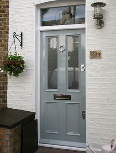 the front door of a white brick house