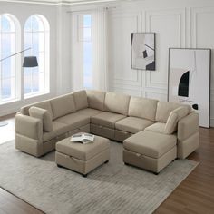 a living room with a sectional couch and ottoman