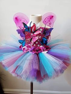 This tutu dress is handmade 100% . It features a stretchy bodice, Rhinestones accents. Perfect for Valentine's Day, pageants, birthdays, holidays, dress up, etc. Fitted Tulle Skirt Pageant Dress For Party, Fitted Fairy Kei Dress For Party, Pink Fitted Fairy Dress For Costume Party, Princess Style Fitted Fairy Dress For Pageant, Fitted Tulle Fairy Dress For Pageant, Fitted Purple Tulle Fairy Dress, Princess Style Fitted Pageant Dress With Tulle Skirt, Whimsical Fitted Fairy Dress For Party, Fitted Whimsical Fairy Dress For Party