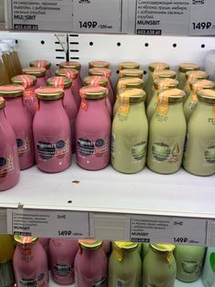 a display in a store filled with lots of different colored juices