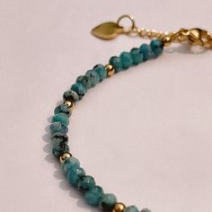 A testament to the serene embrace of a summer's sky, this beaded stacking bracelet captures the very essence of turquoise tranquility. Wear it alone for a subtle pop of color, or layer it with other pieces to craft your own personalized palette of shades. Its flexible design ensures comfort without compromise on style. Gold Plate 6.5" to 7.5" Adjustable Length Waterproof & Tarnish Resistant Nickel- & Lead-Free Everyday Blue Amazonite Bracelets, Turquoise Round Bead Jewelry For Everyday, Everyday Turquoise Jewelry With Round Beads, Everyday Bohemian Turquoise Stretch Bracelet, Hand-strung Blue Amazonite Beaded Bracelets, Bohemian Turquoise Beaded Bracelets For Everyday, Dainty Blue Bracelets With Natural Stones, Everyday Bohemian Turquoise Beaded Bracelets, Bohemian Bracelets With Faceted Beads For Everyday