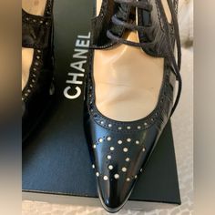 These Chanel Beauties Are Vintage And Come With Original Shoe Bags And Box. They Are A 37.5 Size. I Do Believe They Would Be Best For A 6.5-7 And/Or Medium Or Narrow Foot. Having Said That, I Am A 7 With Medium Width And They Fit Me Fine. The Leather Is Soft. They Have Been Kept In Their Bags And Stored Carefully. Purchased At Saks. One Tiny Spot Is Noted And They Have Brand New Heel Caps. No Gashes On Heels Or Toes- Pristine. Ask Any Questions! Elegant Leather Heels With Laces, Elegant High Heels With Brogue Detailing, Chic Leather Wingtip Heels, Chic Leather Heels With Laces, Elegant Perforated Pointed Toe Heels, Elegant Pointed Toe Heels With Perforations, Elegant Heels With Perforations, Formal Perforated Pointed Toe Heels, Elegant Black Heels With Laces