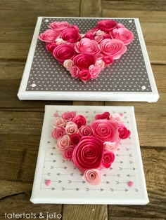 two white trays with pink and red flowers in the shape of a heart on them